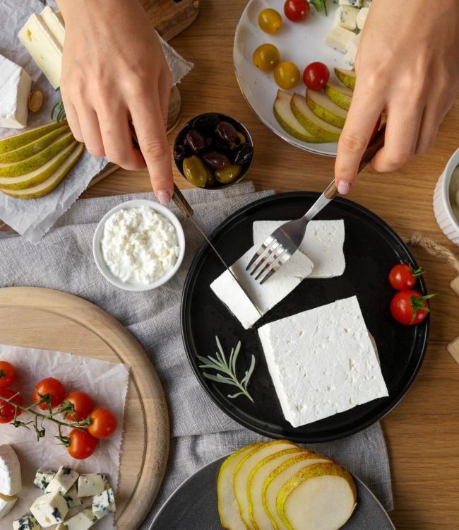 top-view-woman-cutting-cheese