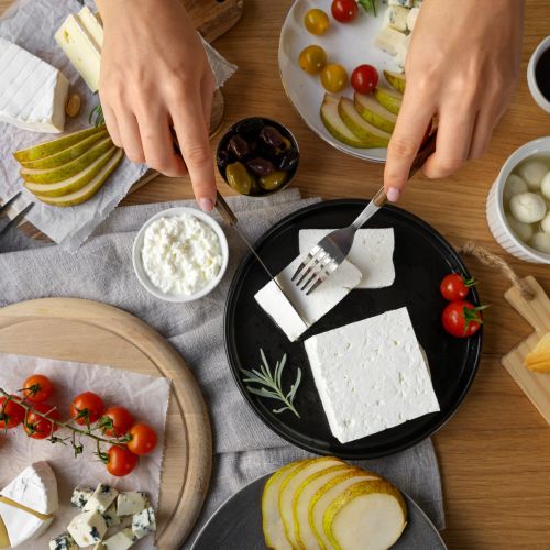 top-view-woman-cutting-cheese